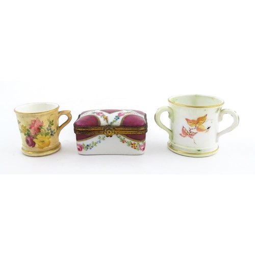 115 - Two miniature Royal Worcester items comprising a mug with floral and foliate decoration, and a tyg w... 