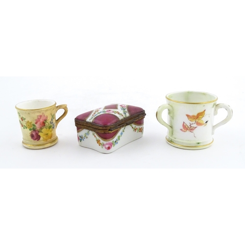 115 - Two miniature Royal Worcester items comprising a mug with floral and foliate decoration, and a tyg w... 