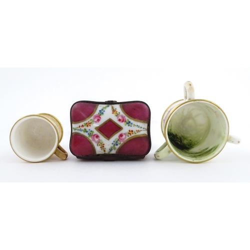 115 - Two miniature Royal Worcester items comprising a mug with floral and foliate decoration, and a tyg w... 