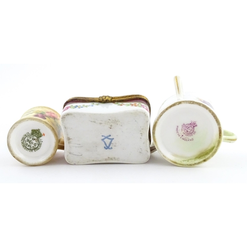 115 - Two miniature Royal Worcester items comprising a mug with floral and foliate decoration, and a tyg w... 