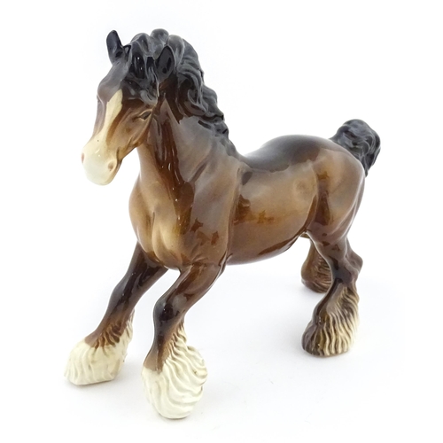 119 - A Beswick model of a Cantering Shire Horse. Marked under. Approx. 8
