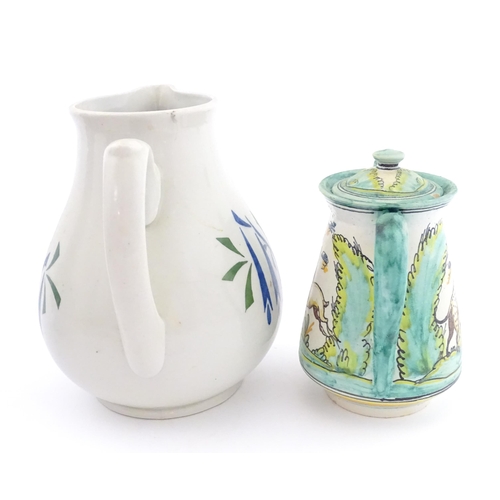 A studio pottery jug with brushwork detail. Marked under with impressed ...