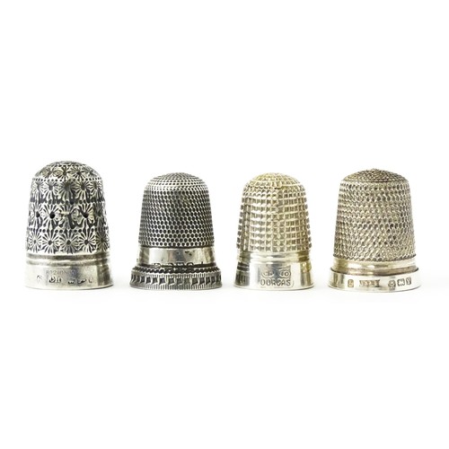 273 - Four thimbles to include three silver examples, one bearing hallmarks for Charles Horner (4)