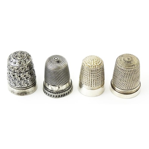 273 - Four thimbles to include three silver examples, one bearing hallmarks for Charles Horner (4)