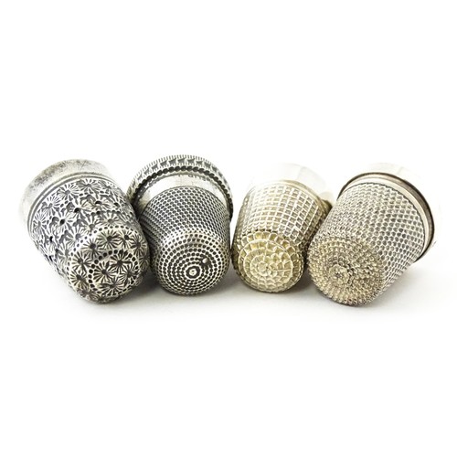 273 - Four thimbles to include three silver examples, one bearing hallmarks for Charles Horner (4)