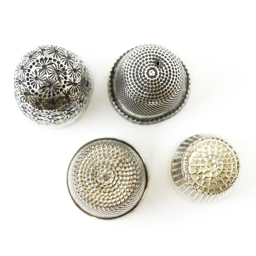 273 - Four thimbles to include three silver examples, one bearing hallmarks for Charles Horner (4)