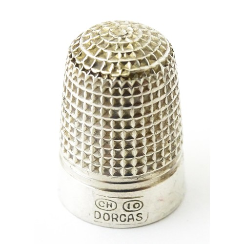 273 - Four thimbles to include three silver examples, one bearing hallmarks for Charles Horner (4)