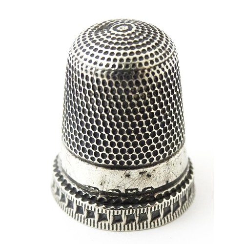 273 - Four thimbles to include three silver examples, one bearing hallmarks for Charles Horner (4)