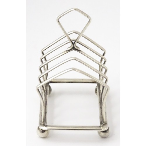 297 - A small silver five bar toast rack hallmarked Birmingham 1922, maker Adie Brothers. Approx. 3