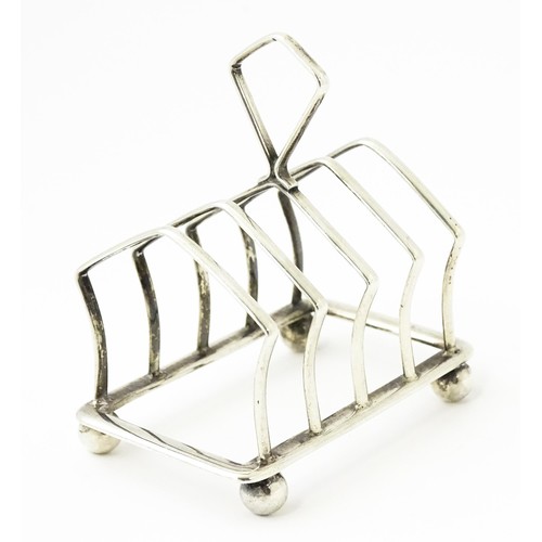 297 - A small silver five bar toast rack hallmarked Birmingham 1922, maker Adie Brothers. Approx. 3