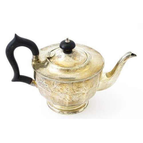 367 - A silver teapot with ebonised handle and finial. Hallmarked Sheffield 1931 maker Viners ltd. Approx.... 