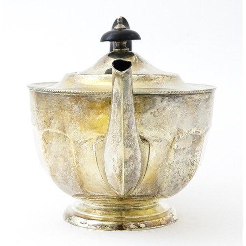 367 - A silver teapot with ebonised handle and finial. Hallmarked Sheffield 1931 maker Viners ltd. Approx.... 