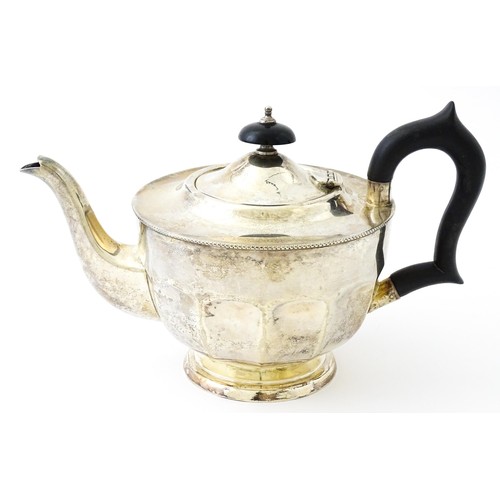 367 - A silver teapot with ebonised handle and finial. Hallmarked Sheffield 1931 maker Viners ltd. Approx.... 