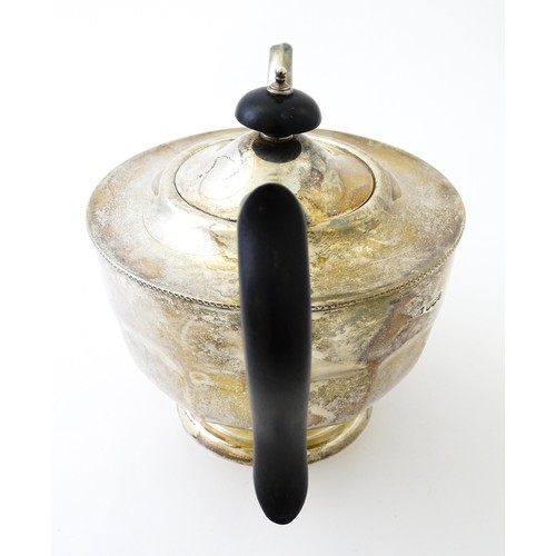 367 - A silver teapot with ebonised handle and finial. Hallmarked Sheffield 1931 maker Viners ltd. Approx.... 