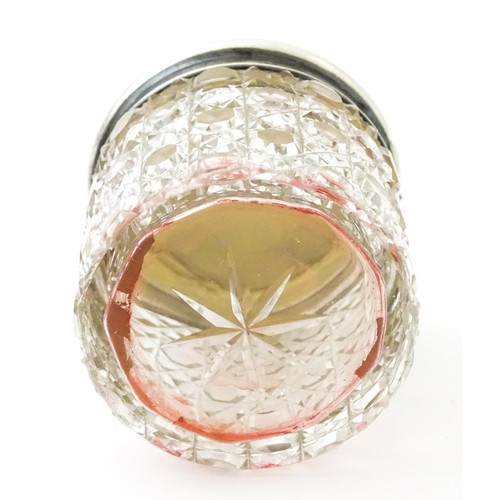 381 - A pair of cut glass dressing table pots with silver lids. Together with another. (3)
