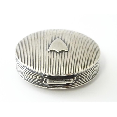 382 - A Dutch silver pill box with shield detail. Approx. 2