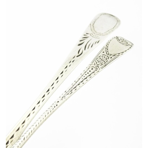 390 - Two George III silver teaspoons with bright cut decoration, one hallmarked London 1803. Largest appr... 