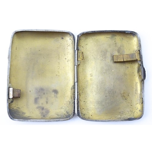 413 - A silver cigarette case with engraved decoration hallmarked Birmingham 1911, maker Joseph Gloster. A... 
