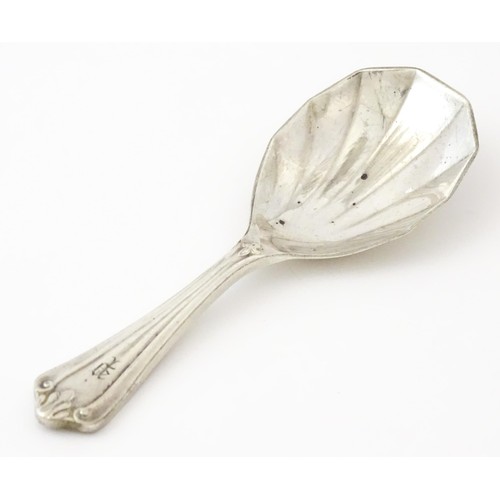 401 - A silver caddy spoon with shell formed bowl, hallmarked Birmingham 1913, maker Elkington & Co Ltd. A... 