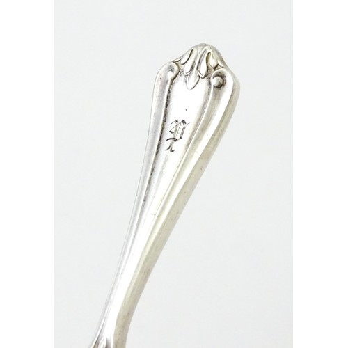 401 - A silver caddy spoon with shell formed bowl, hallmarked Birmingham 1913, maker Elkington & Co Ltd. A... 