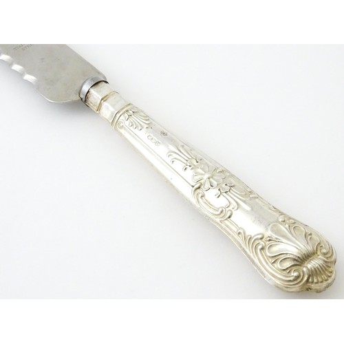 393 - A silver handled King's pattern bread knife. Hallmarked Sheffield 1964, maker Harrison Brothers.  Ap... 