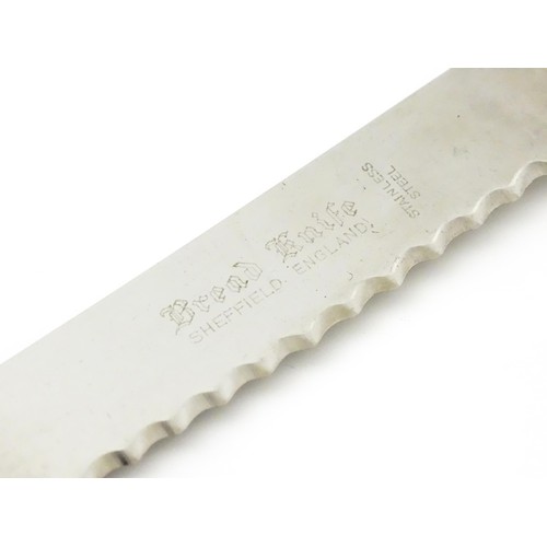 393 - A silver handled King's pattern bread knife. Hallmarked Sheffield 1964, maker Harrison Brothers.  Ap... 