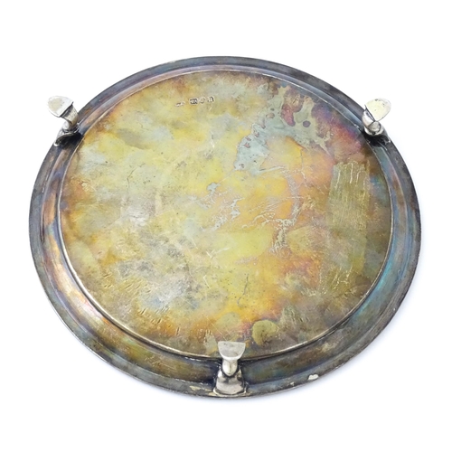 292 - A silver card tray raised on three feet. Hallmarked London 1908 maker John Henry Rawlings. Approx 7 ... 