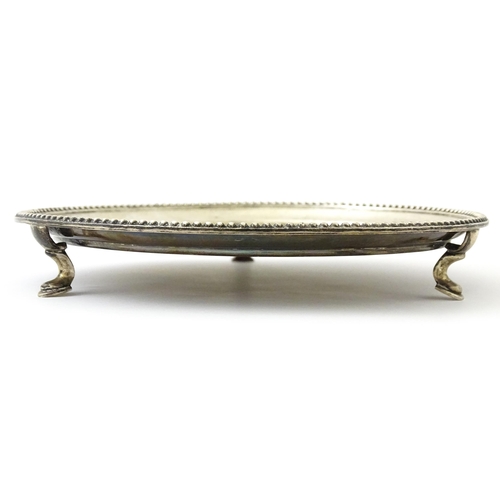 292 - A silver card tray raised on three feet. Hallmarked London 1908 maker John Henry Rawlings. Approx 7 ... 