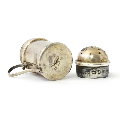 352 - Two silver pepperettes / pepper pots formed as flour shakers. hallmarked Birmingham 1900 maker T H H... 