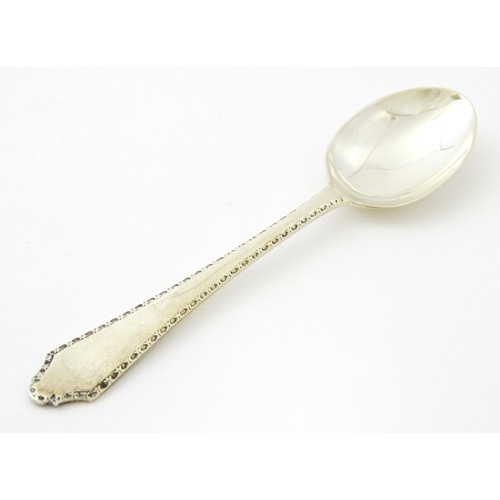 403 - A silver bud vase, hallmarked Birmingham 1988, maker A. E. Jones. Together with a silver teaspoon, h... 