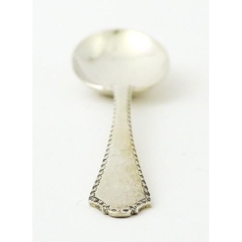 403 - A silver bud vase, hallmarked Birmingham 1988, maker A. E. Jones. Together with a silver teaspoon, h... 