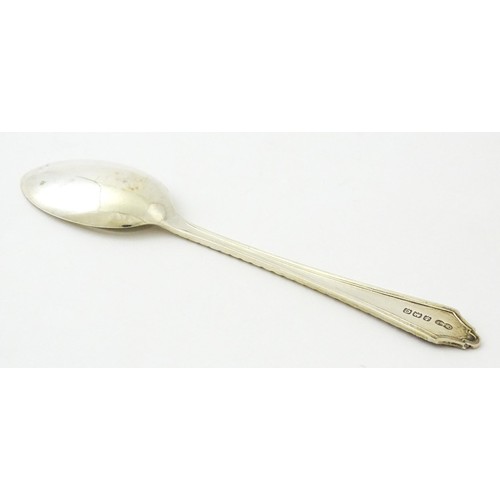 403 - A silver bud vase, hallmarked Birmingham 1988, maker A. E. Jones. Together with a silver teaspoon, h... 