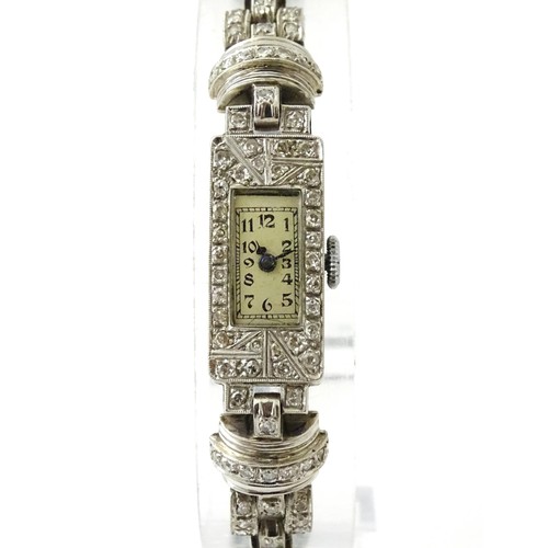 769 - A ladies Art Deco Seeland Watch Co. platinum cased wristwatch set with diamonds. The watch approx 1/... 
