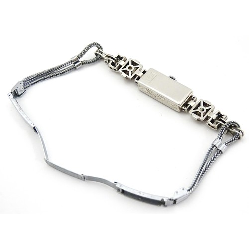 769 - A ladies Art Deco Seeland Watch Co. platinum cased wristwatch set with diamonds. The watch approx 1/... 