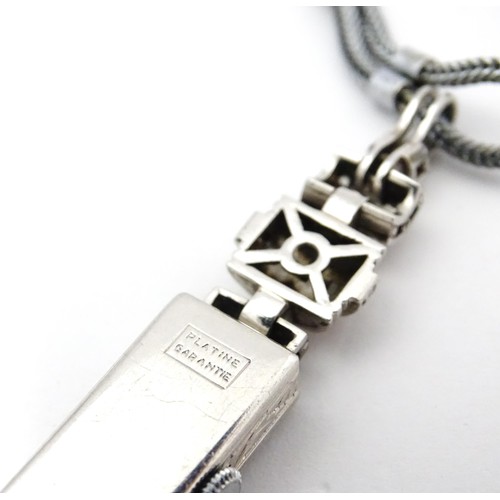 769 - A ladies Art Deco Seeland Watch Co. platinum cased wristwatch set with diamonds. The watch approx 1/... 