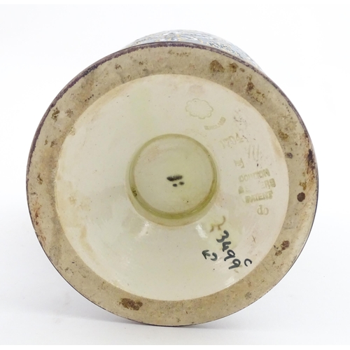 103 - A Doulton Lambeth vase decorated with flowers and foliage, having gilt highlights. Marked under with... 