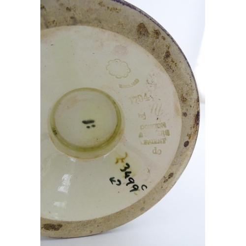 103 - A Doulton Lambeth vase decorated with flowers and foliage, having gilt highlights. Marked under with... 