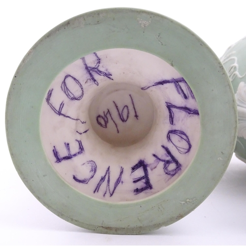 110 - A pair of parian vases in the manner of Wedgwood Jasperware depicting the Three Graces to one side, ... 