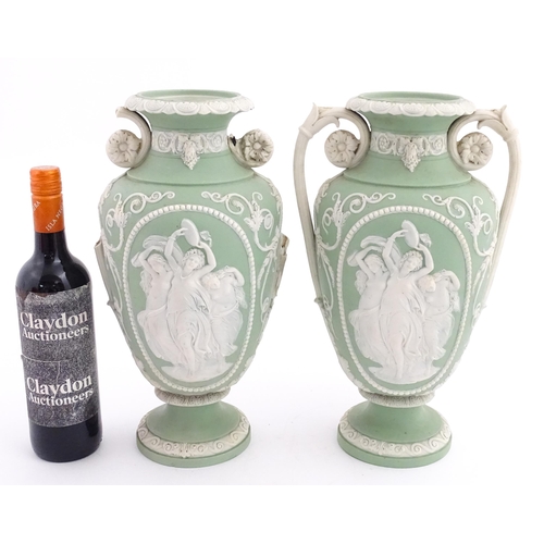 110 - A pair of parian vases in the manner of Wedgwood Jasperware depicting the Three Graces to one side, ... 