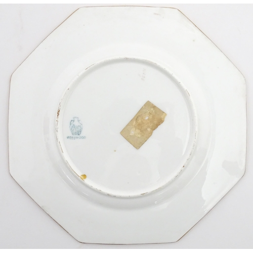 112 - Two Wedgwood plates of octagonal form with hand painted flower decoration. Marked under. Approx. 8 3... 