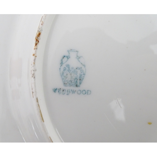 112 - Two Wedgwood plates of octagonal form with hand painted flower decoration. Marked under. Approx. 8 3... 