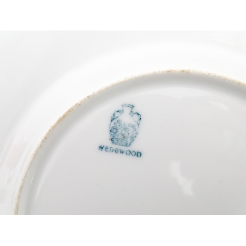 112 - Two Wedgwood plates of octagonal form with hand painted flower decoration. Marked under. Approx. 8 3... 