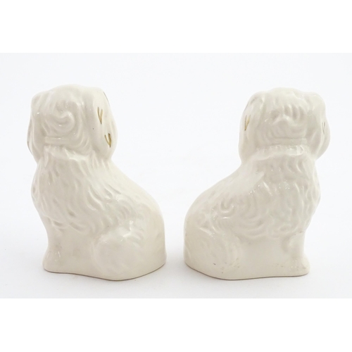117 - A pair of small Royal Doulton Staffordshire style seated spaniels. Approx. 3 1/2