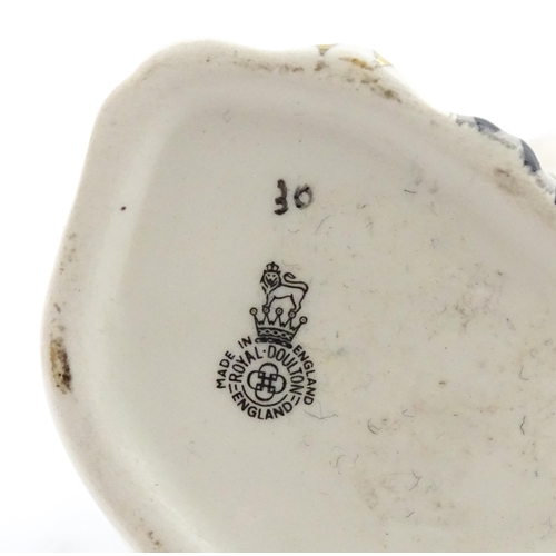 117 - A pair of small Royal Doulton Staffordshire style seated spaniels. Approx. 3 1/2