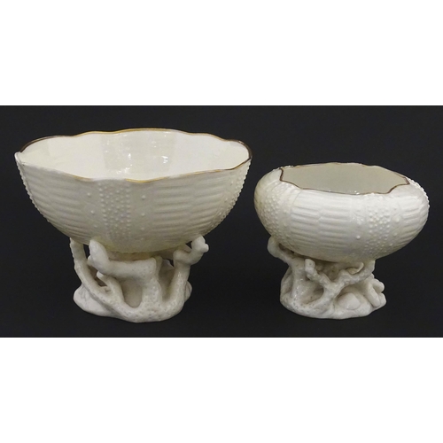 84 - Belleek tea wares in the Echinus pattern to include teapots, sugar bowls, milk jug, cup and saucer. ... 