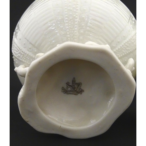 84 - Belleek tea wares in the Echinus pattern to include teapots, sugar bowls, milk jug, cup and saucer. ... 