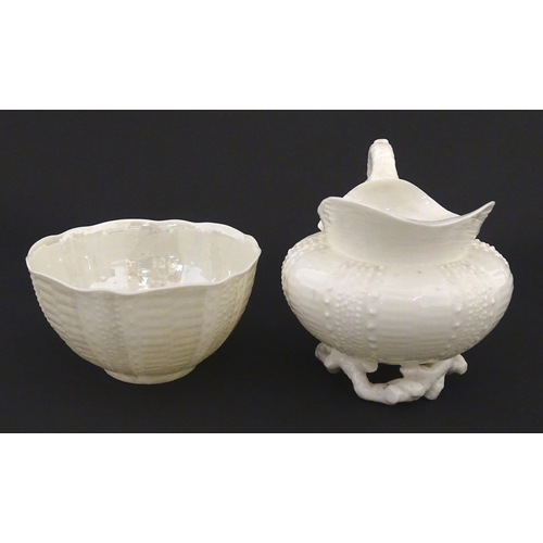 84 - Belleek tea wares in the Echinus pattern to include teapots, sugar bowls, milk jug, cup and saucer. ... 