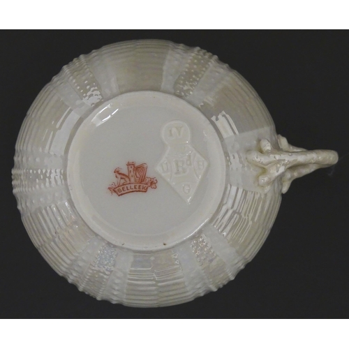 84 - Belleek tea wares in the Echinus pattern to include teapots, sugar bowls, milk jug, cup and saucer. ... 