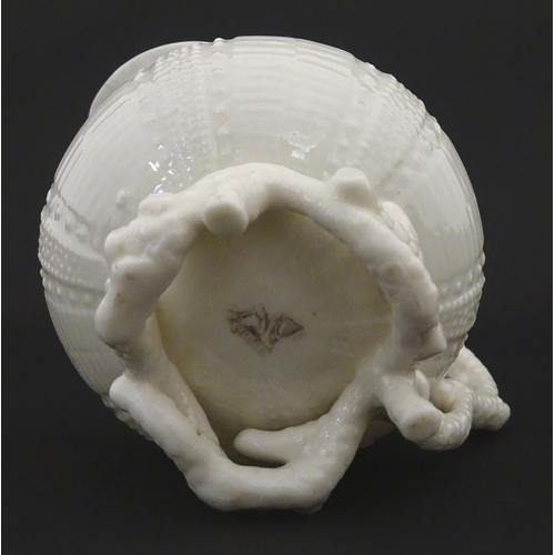 84 - Belleek tea wares in the Echinus pattern to include teapots, sugar bowls, milk jug, cup and saucer. ... 