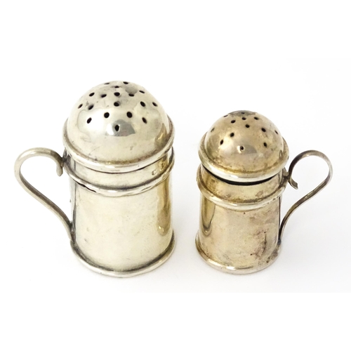352 - Two silver pepperettes / pepper pots formed as flour shakers. hallmarked Birmingham 1900 maker T H H... 